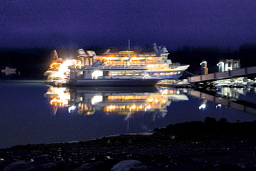 The Lindblad Expeditions ship National Geographic Sea Lion docked at Gustavus in the evening in Southeast Alaska, USA. Pacific Ocean.