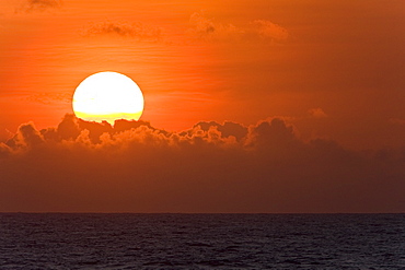 Sunrise or sunset at sea in the Atlantic Ocean from onboard the National Geographic Endeavour crossing the Atlantic Ocean from Lisbon, Portugal to Salvador, Brazil.