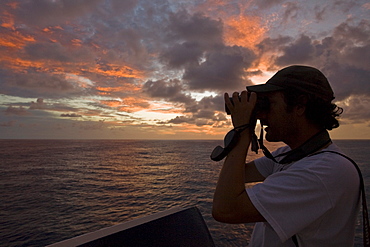 Sunrise or sunset at sea in the Atlantic Ocean from onboard the National Geographic Endeavour crossing the Atlantic Ocean from Lisbon, Portugal to Salvador, Brazil.