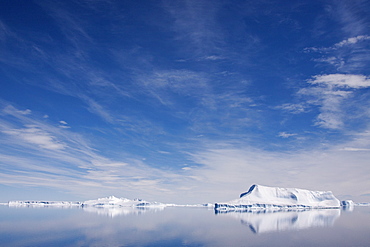 The Lindblad Expeditions ship National Geographic Explorer pushes through ice in Crystal Sound, south of the Antarctic Circle, Antarctica, Southern Ocean