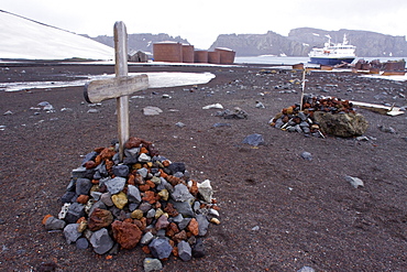 Grave markers at Whalers Bay inside of the caldera at Deception Island, South Shetland Islands, Antarctica, Southern Ocean