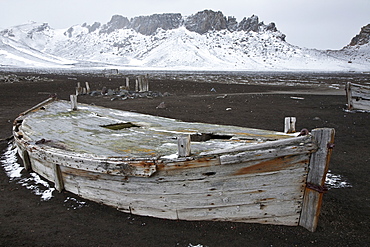 Abandoned water boat at Whalers Bay inside of the caldera at Deception Island, South Shetland Islands, Antarctica, Southern Ocean