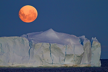 Full moon (plus 1 day) rising over icebergs in the Weddell Sea, Antarctica. MORE INFO This moonrise occurred on January 1, 2010, the night after the blue moon full of December 31, 2009.