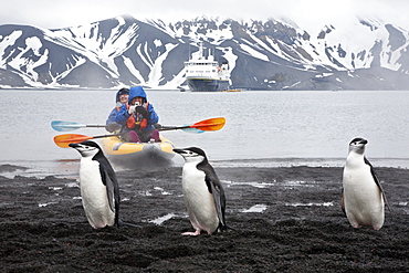 Guests from the Lindblad Expedition ship National Geographic Explorer kayaking in and around the Antarctic Peninsula in the summer months. 