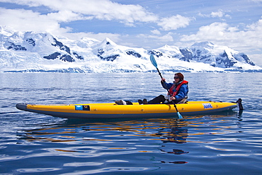 Guests from the Lindblad Expedition ship National Geographic Explorer kayaking in and around the Antarctic Peninsula in the summer months. 