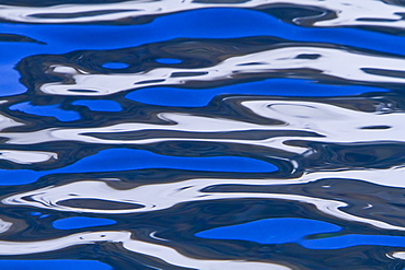 Reflections in calm water photographed from the Lindblad Expedition Ship National Geographic Explorer operating in Antarctica, Southern Ocean.