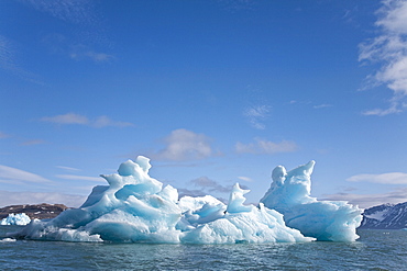 Calved icebergs from the glaciers at BlomstrandhalvÃ®ya in Kongsfjord on the western side of Spitsbergen in the Svalbard Archipelago, Norway.