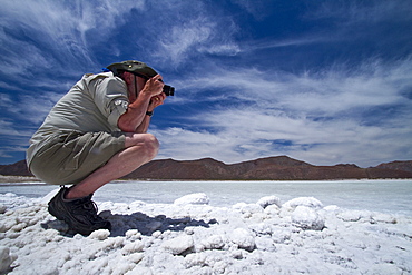 Guests from the Lindblad Expedition ship National Geographic Sea Bird taking photos at the Salinas salt mine on Isla del Carmen in the Gulf of California (Sea of Cortes), Baja California Sur, Mexico. 