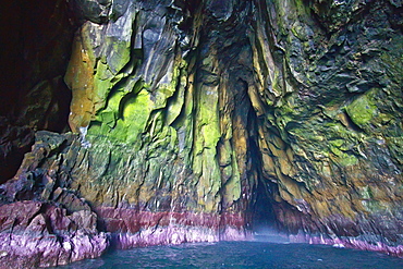 Zodiacs cruising through the sea caves of Fugloy in the Faroe Islands