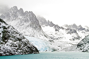 Views of Larsen Harbour in Drygalski Fjord during a snowstorm on South Georgia, Southern Ocean