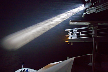 The Lindblad Expedition Ship National Geographic Explorer operating in gale-force winds and driving snow at night by spotlight in the Bransfield Strait, Antarctica