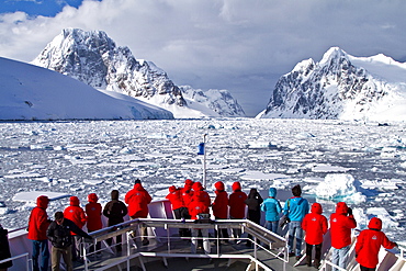 Guests from the Lindblad Expedition ship National Geographic Explorer enjoy the Lemaire Channel in Antarctica