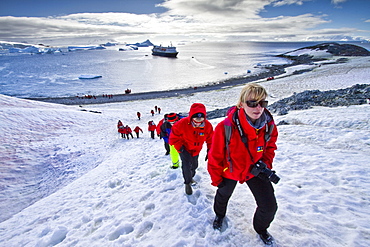 Guests from the Lindblad Expedition ship National Geographic Explorer enjoy Cuverville Island, Antarctica