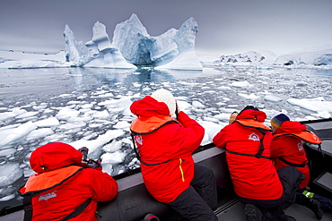 Guests from the Lindblad Expedition ship National Geographic Explorer enjoy Antarctica by Zodiac