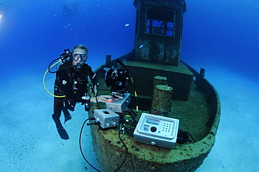 Neil Lucas with underwater time lapse system on the wreck of the 'Blue Plunder'. Bahamas.