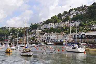 Sailing yachts, pleasure boats and fishing boats moored in Looe harbour, Cornwall, England, United Kingdom, Europe