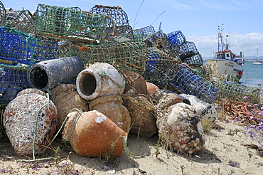 Stack of lobster pots and ceramic octopus pots on Culatra island, Parque Natural da Ria Formosa, near Olhao, Algarve, Portugal, Europe