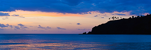 Silhouette of palm trees on a cliff at sunset, Nippah Beach, Lombok, Indonesia, Southeast Asia, Asia