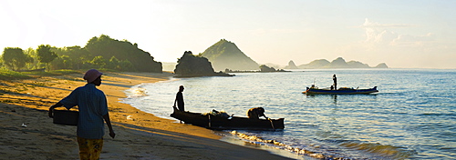 Panorama of a woman waiting for the fisherman to return at Kuta Beach, Kuta Lombok, Indonesia, Southeast Asia, Asia