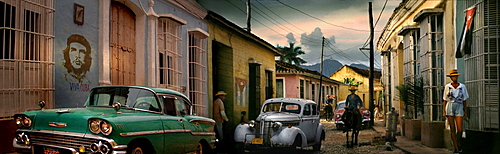 Street scene with oldtimer, horse and Che Guevara wall painting, Trinidad, Sancti Spiritus, Cuba, Carribean, North America, America