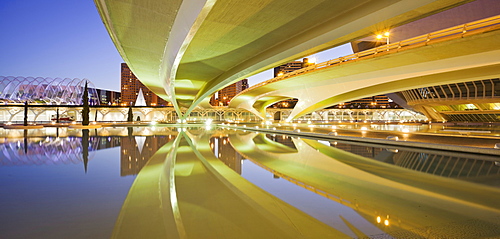 Reflection of illuminated bridge on the water, Ciudad de las Artes y de las Ciencias, Valencia, Spain, Europe