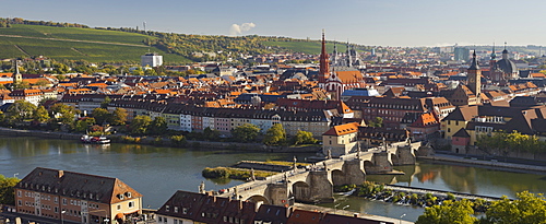 View from Marienberg fortress over Wuerzburg, Alte Mainbruecke bridge and river Main, Neumuenster Kollegiatstift, St Kilian's cathedral, Wuerzburg, Bavaria, Germany