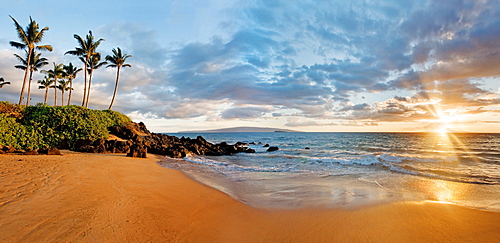 Hawaii, Maui, Makena, Secret Beach at sunset.