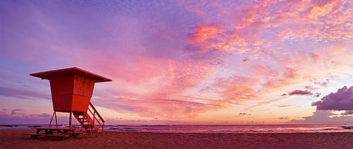 Hawaii, Kauai, Salt Ponds Beach, Lifeguard tower at sunset.