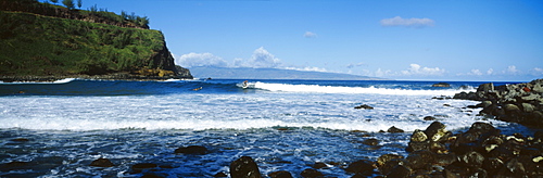 Hawaii, Maui, Honokahau coast, Surfers on waves close to shore.