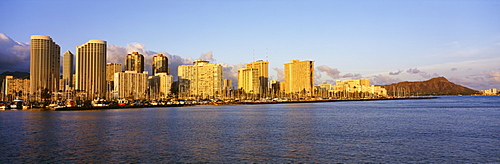 Hawaii, Oahu, Waikiki and Diamond Head in the afternoon sunlight, View from ocean.