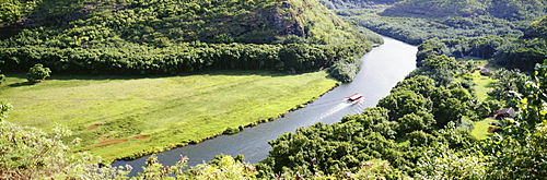 Hawaii, Kauai, aerial view of Wailua River with tour boat, greenery, panoramic