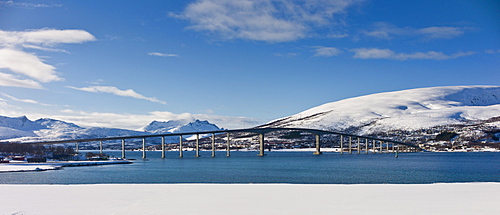 Arctic landscape Sandnesundbrua Bridge joining Kvaloya Island and Tromsoya Island at Tromso in Arctic Circle, Northern Norway