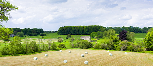 English countryside with chapel in a field, St Oswald's, in The Cotswolds, Oxfordshire