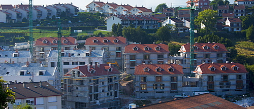 New housing development building site in San Vicente de la Barquera, Cantabria. There has been EU funding for many building projects in Spain.