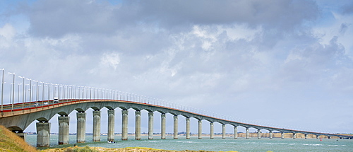 Traffic crossing causeway bridge connecting the island of Ile de Re with La Rochelle on the mainland in France