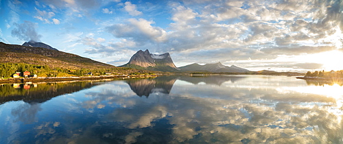 Panorama of pink clouds reflected in the clear blue sea at midnight sun, Anepollen Fjord, Nordland, Norway, Scandinavia, Europe