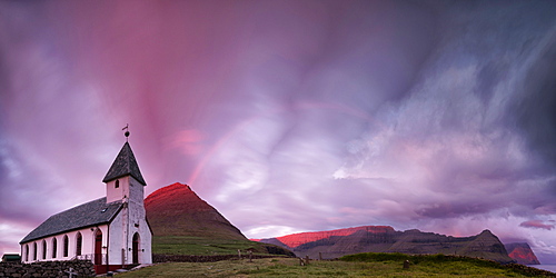 Panoramic of church of Vidareidi at sunrise, Vidoy island, Faroe Islands, Denmark, Europe