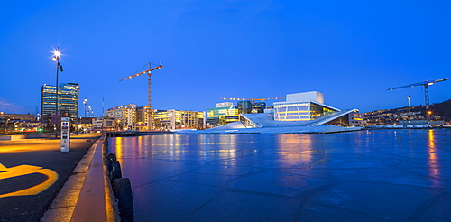 Night panoramic view of the Oslo Opera House, frozen bay and new business quarter, Oslo, Norway, Scandinavia, Europe