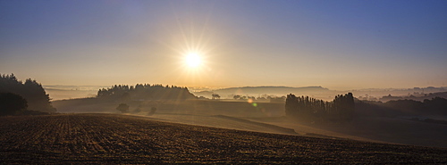 Extensive dawn mist over the fields and Exe estuary, viewed from Mamhead, Starcross, Devon, England, United Kingdom, Europe