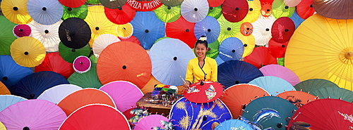 Woman painting umbrellas, umbrella making factory, Bo Sang umbrella village, Bo Sang, Chiang Mai, northern Thailand, Thailand, Southeast Asia, Asia