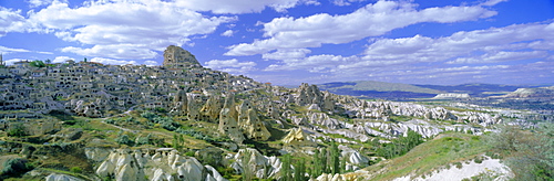 Panoramic view of the town of Uchisar with its old houses and ancient cave dwellings in the volcanic tufa, Cappadocia, Anatolia, Turkey, Asia Minor, Asia