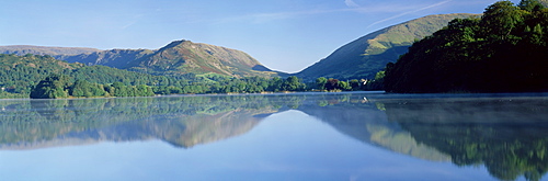 Perfect reflection in early morning, Grasmere, near Ambleside, Lake District, Cumbria, England, United Kingdom, Europe