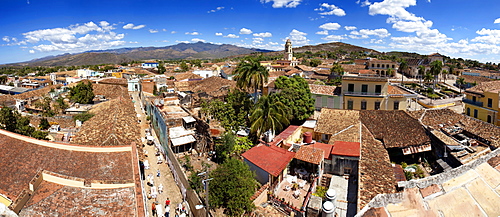 Panoramic view over the pantiled rooftops and cobbled streets of the town towards the belltower of The Convento de San Francisco de Asis, Trinidad, UNESCO World Heritage Site, Cuba, West Indies, Central America 