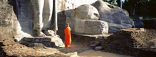 Buddhist monk at the Gal Vihara, Polonnaruwa (Polonnaruva), UNESCO World Heritage Site, Sri Lanka, Asia