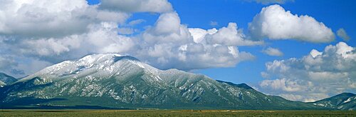 Clouds over snowcapped mountains, Taos, New Mexico, USA