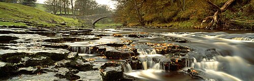 Arch bridge over a river, Stainforth Force, River Ribble, North Yorkshire, England