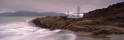 Waves breaking on rocks, Golden Gate Bridge, Baker Beach, San Francisco, California, USA