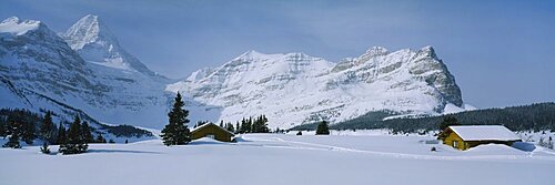 Log cabins on a snow covered landscape, Mt Assiniboine, British Columbia, Canada