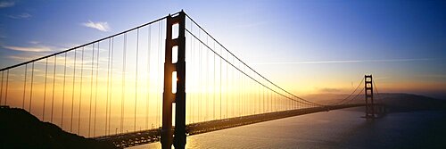 Silhouette of a bridge at dawn, Golden Gate Bridge, San Francisco, California, USA