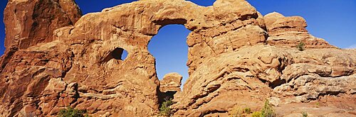 Low angle view of rock formations, Turret Arch, Arches National Park, Utah, USA